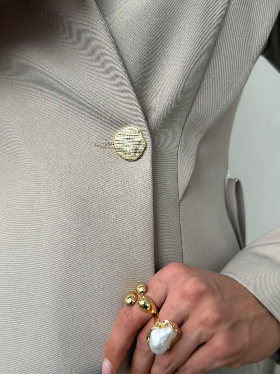 Stone beige suit — blazer fabric and closure detail